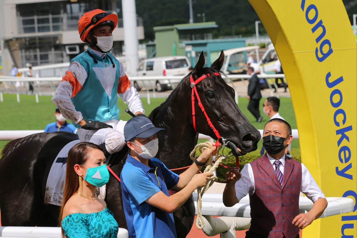 Jockey Joao Moreira celebrates a winner on Sunday before later suffering dehydration. Photos: Kenneth Chan