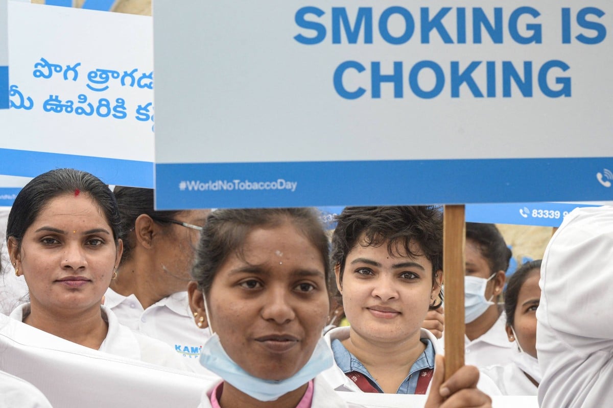 Medical students and staff from a hospital display placards during an awareness rally against the use of tobacco on World No Tobacco Day in Hyderabad, India on May 31, 2022. Photo: AFP