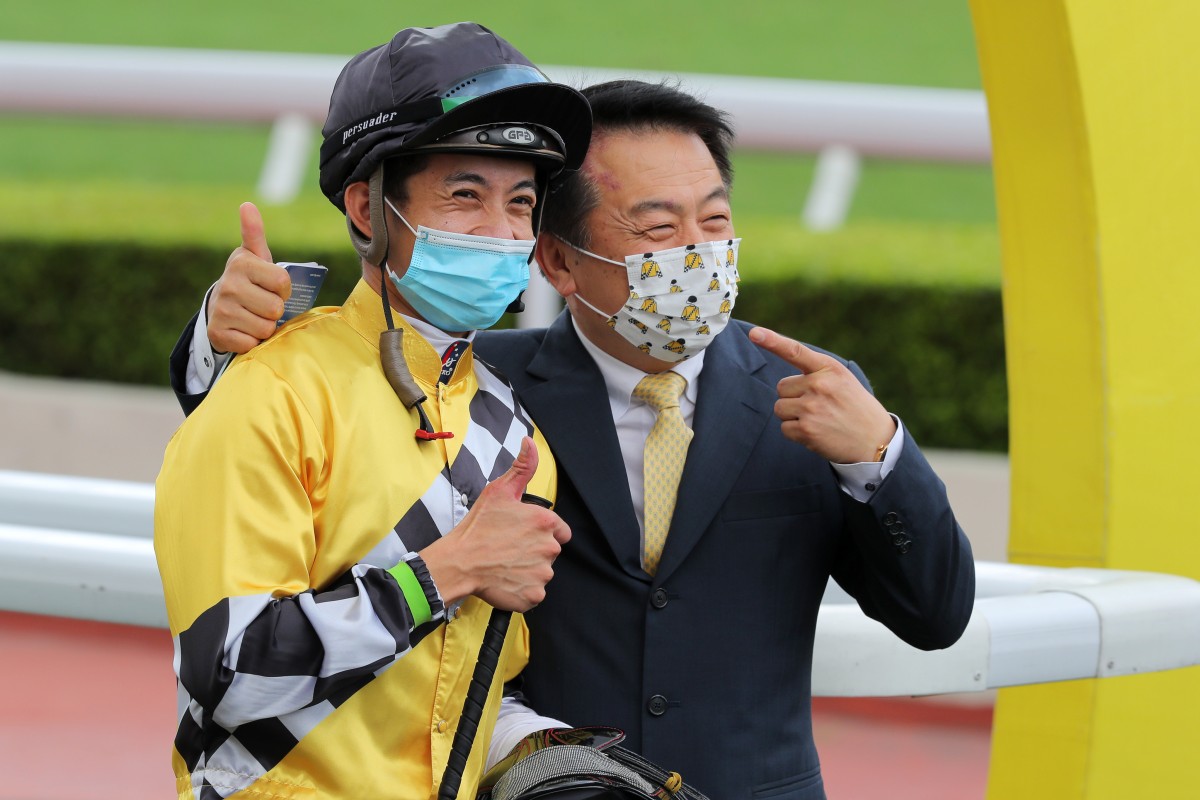 Jockey Derek Leung and trainer Ricky Yiu are all smiles following All Riches’ victory. Photo: Kenneth Chan