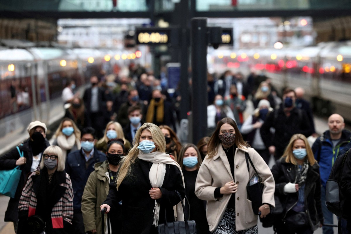 People walk along a platform at Kings Cross train station during morning rush hour amid an outbreak of coronavirus in London. Photo: Reuters