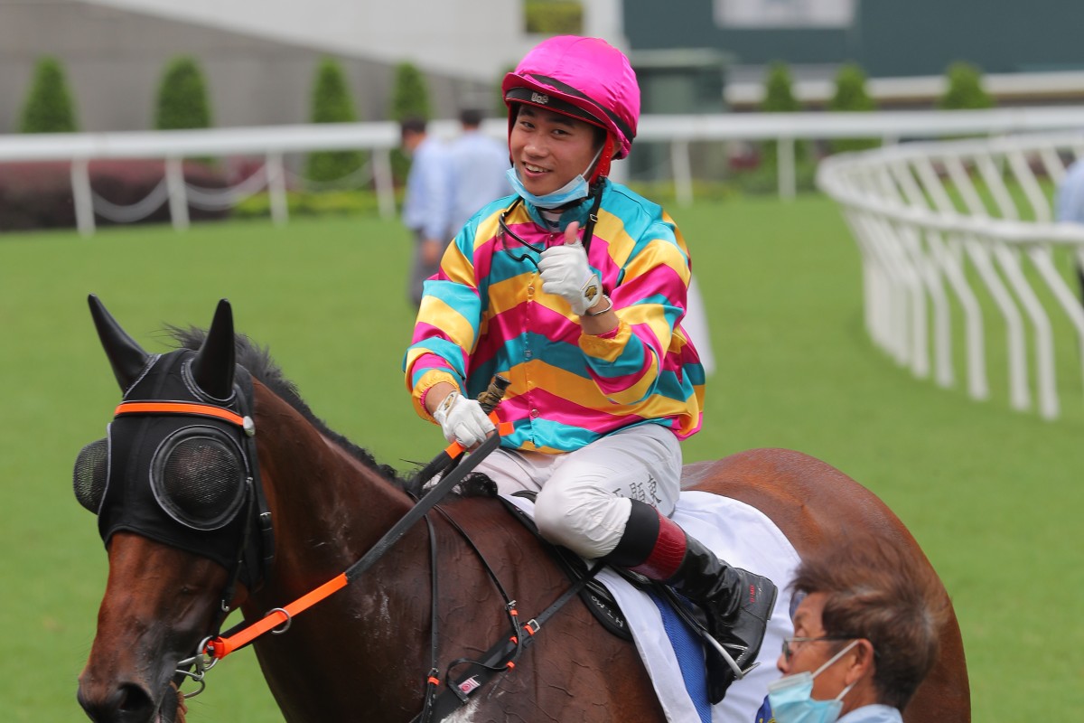 Dylan Mo celebrates the recent win of Super Axiom at Sha Tin. Photo: Kenneth Chan