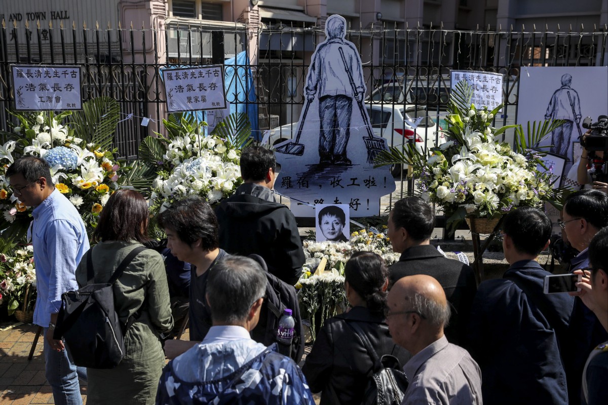 Well wishers in Sheung Shui pay respects to the elderly man, Luo Changqing, who passed away after being injured by a brick during a clash between anti-government protesters and residents. Photo: Winson Wong