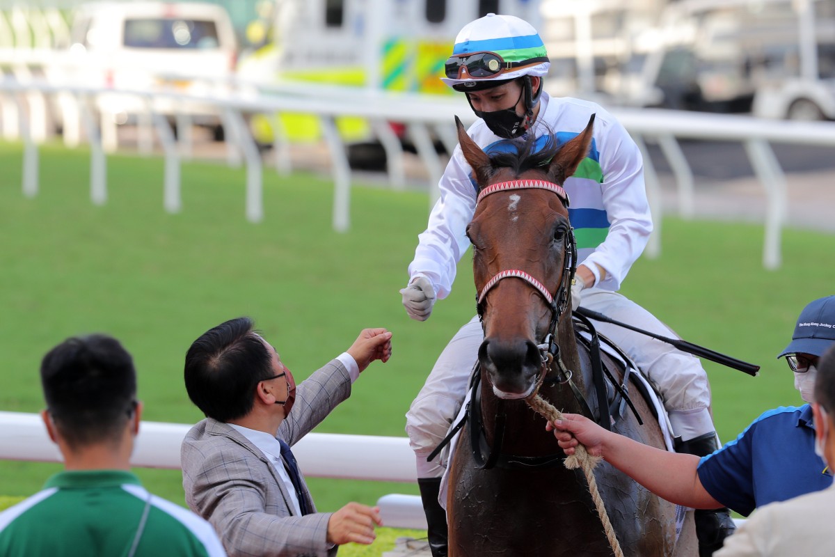 Jockey Matthew Chadwick and trainer Ricky Yiu celebrate Voyage Bubble’s victory. Photos: Kenneth Chan