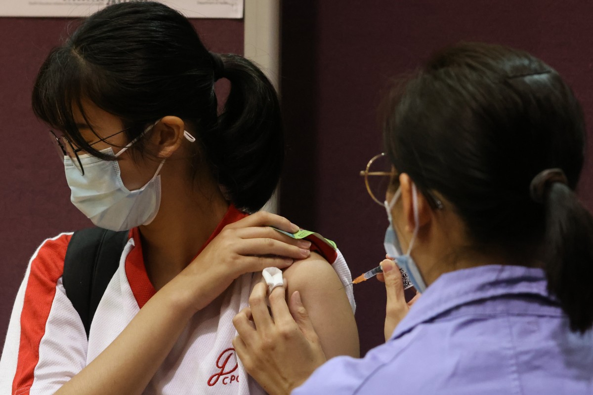 Hongkongers who have recovered from Covid-19 should still get three doses of vaccine, says expert. Photo: May Tse