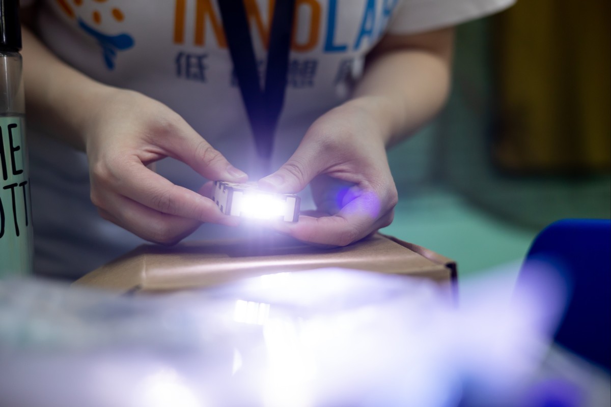 Participants learn how to make solar energy torches during The Jockey Club SolarCare Program
Solar Innovation Workshop. Photo: Handout