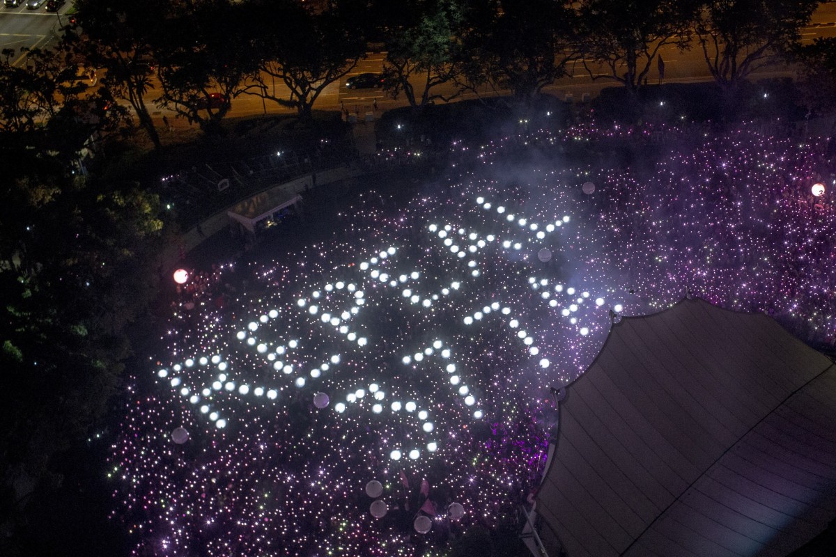 The words ‘Repeal 377A’ are formed by the crowd at the Pink Dot pride event in 2019. File photo: EPA-EFE