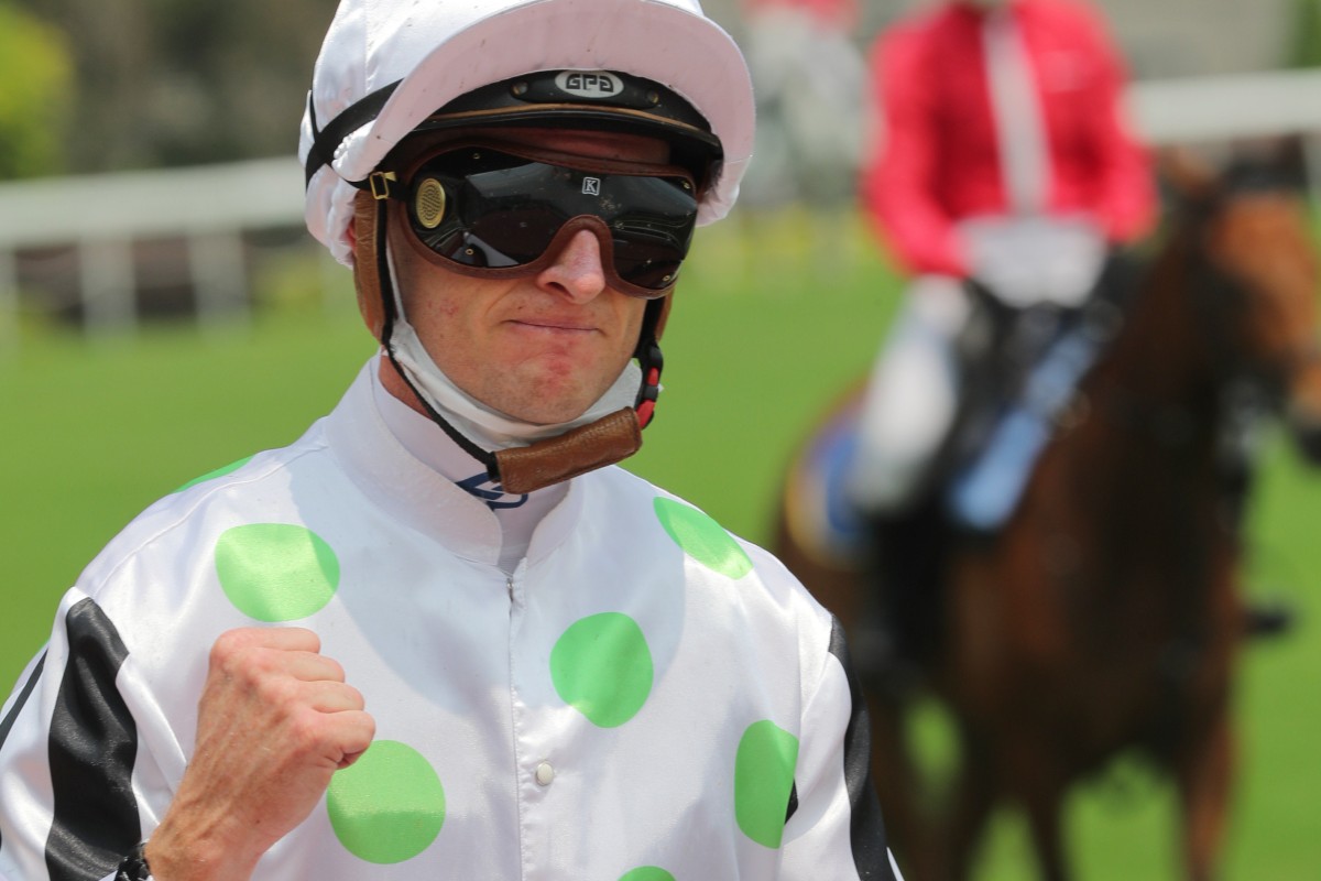 Zac Purton pumps his fist after winning the first race of the season. Photo: Kenneth Chan