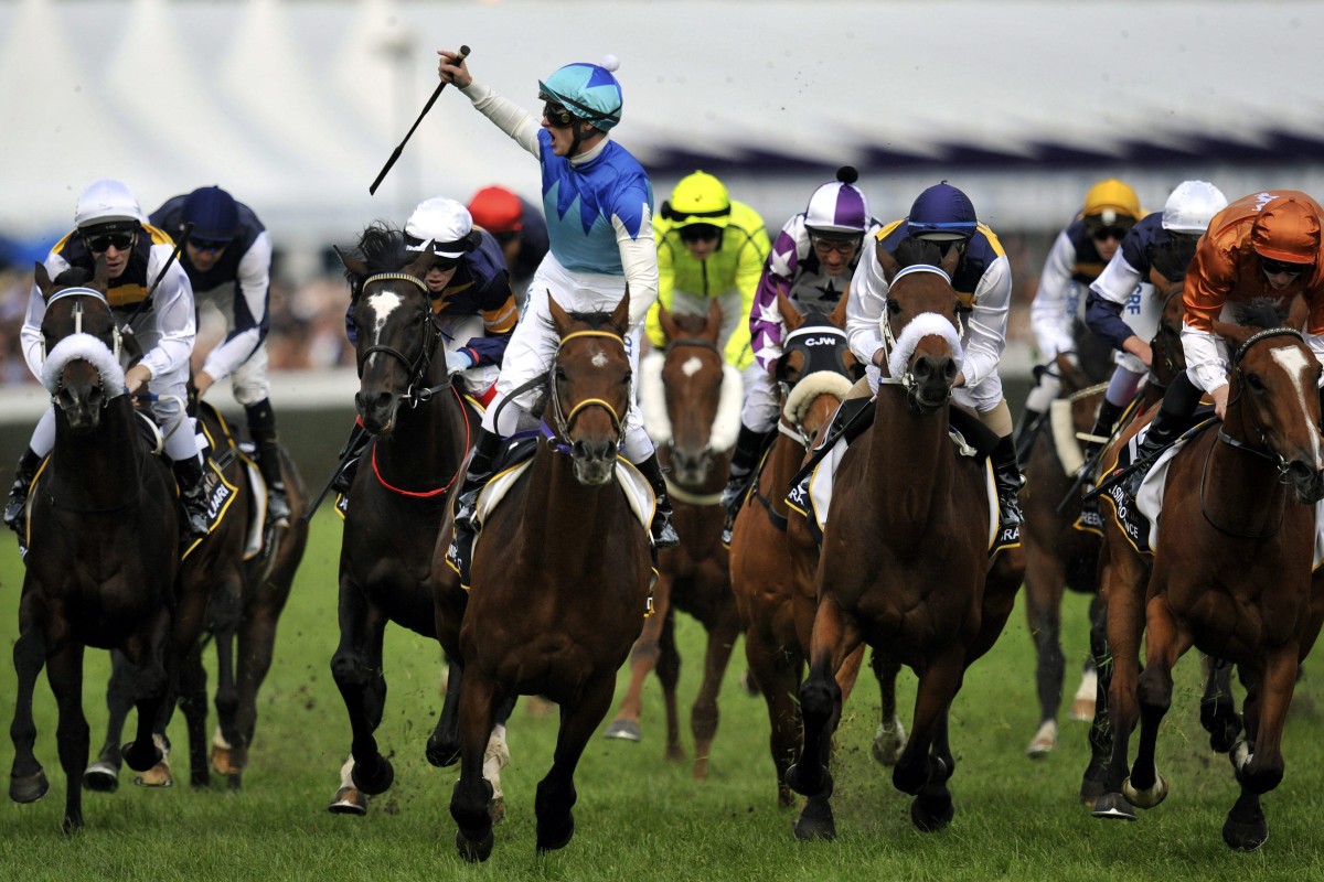 Zac Purton celebrates winning the 2014 Caulfield Cup on Japanese horse Admire Rakti. Photo: EPA