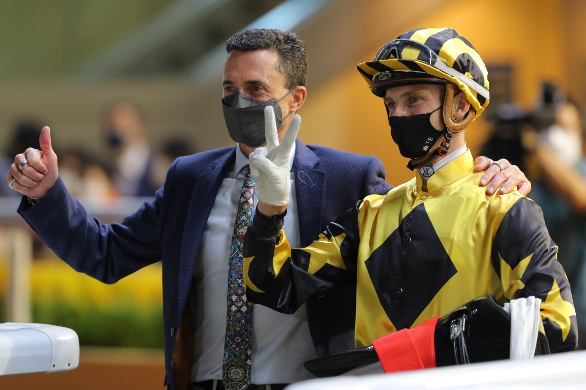 Trainer Douglas Whyte and jockey Lyle Hewitson celebrate Durham Star’s victory at Happy Valley on Wednesday night. Photos: Kenneth Chan