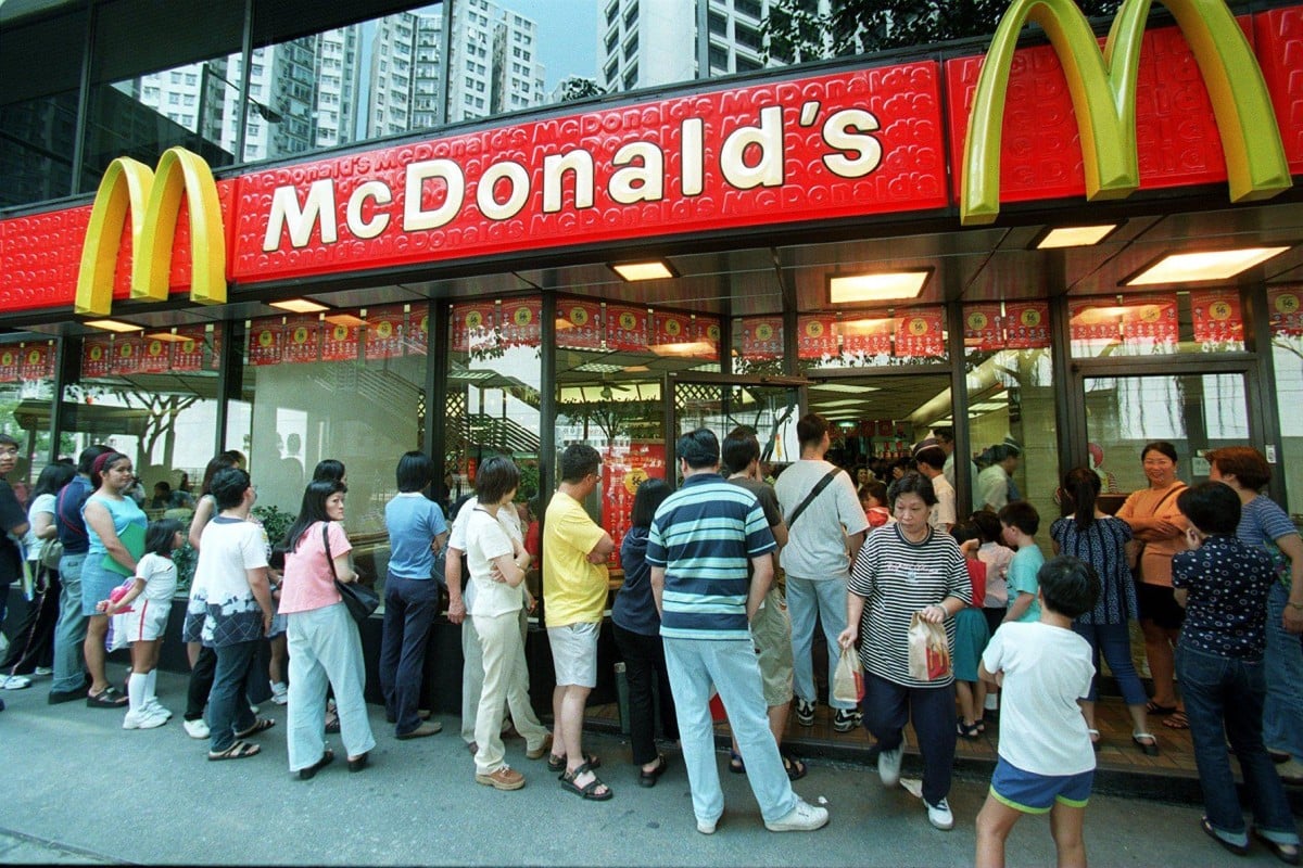 Hundreds of people queue outside a McDonald’s shop for Snoopy figurines in 1998. Photos: SCMP
