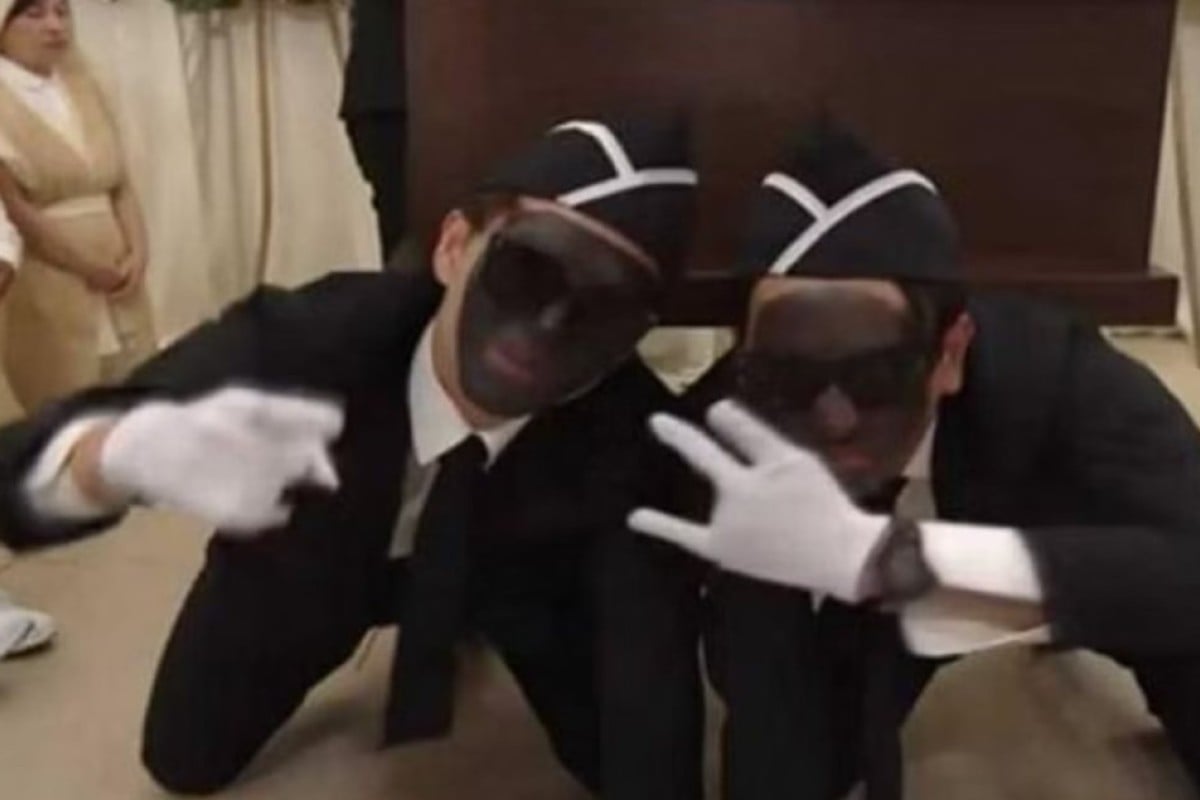 In the episode, four people are seen wearing black make-up while singing and dancing as they carry a coffin out of a room at a memorial. Photo: YouTube