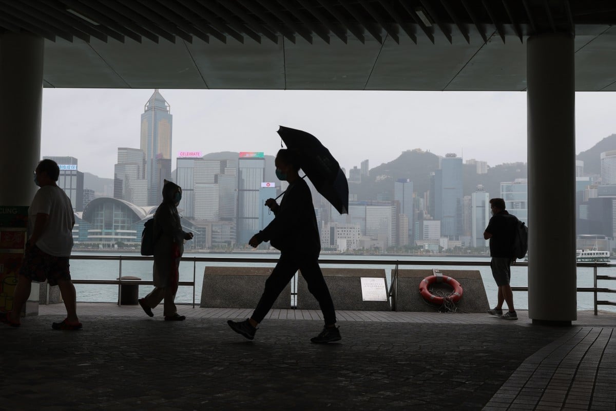 People walk on Tsim Sha Tsui pier as Tropical Storm Nalgae nears the city. Photo: Yik Yeung-man