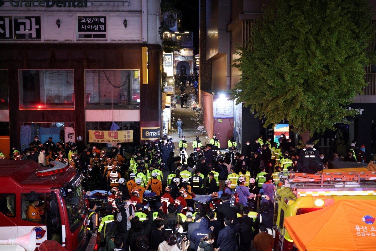 Rescue teams and firefighters work at the scene where dozens of people were injured in a stampede during a Halloween festival in Seoul, South Korea on October 29, 2022. Photo: Reuters