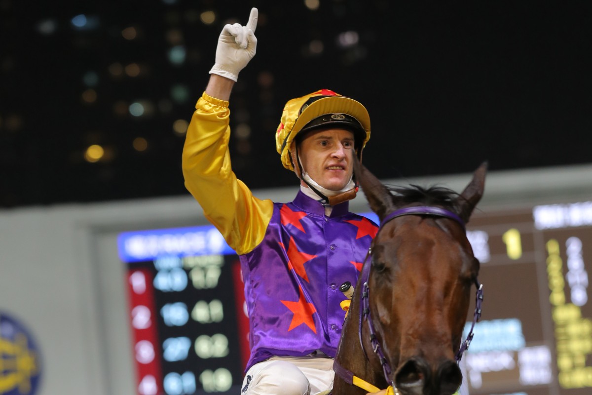 Zac Purton celebrates his record-breaking win at Happy Valley last night. Photos: Kenneth Chan
