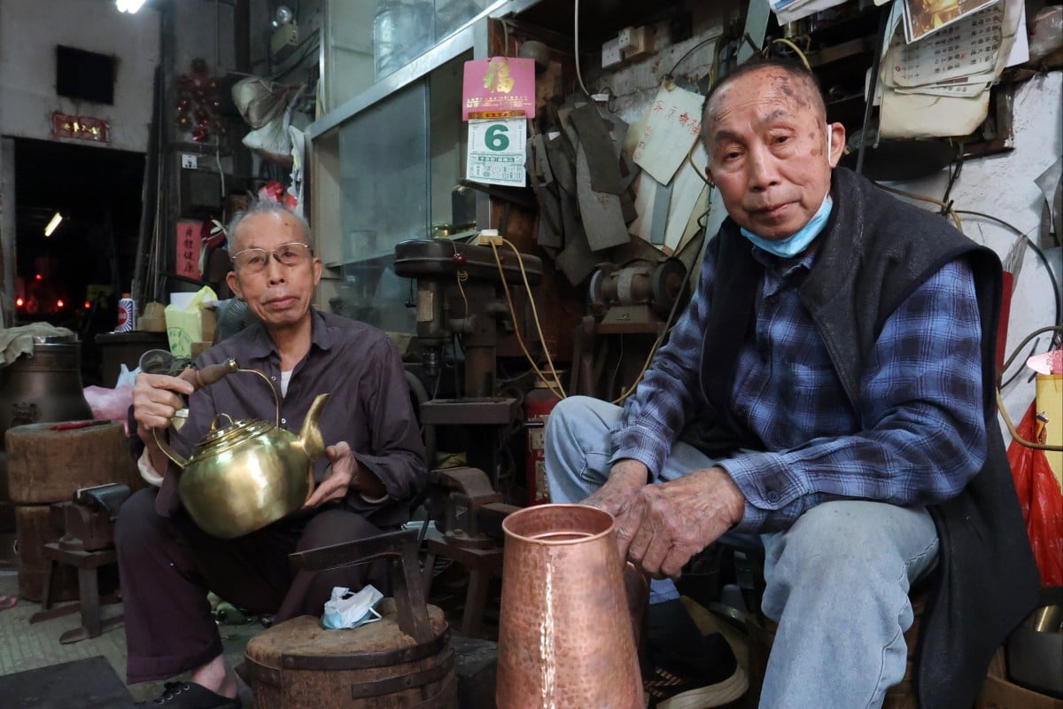 The owners of Ping Kee Copperware – two brothers, Luk Keung-choi (left) and Luk Shu-choi – have been hammering copper cookware for decades. Photo: Edmond So