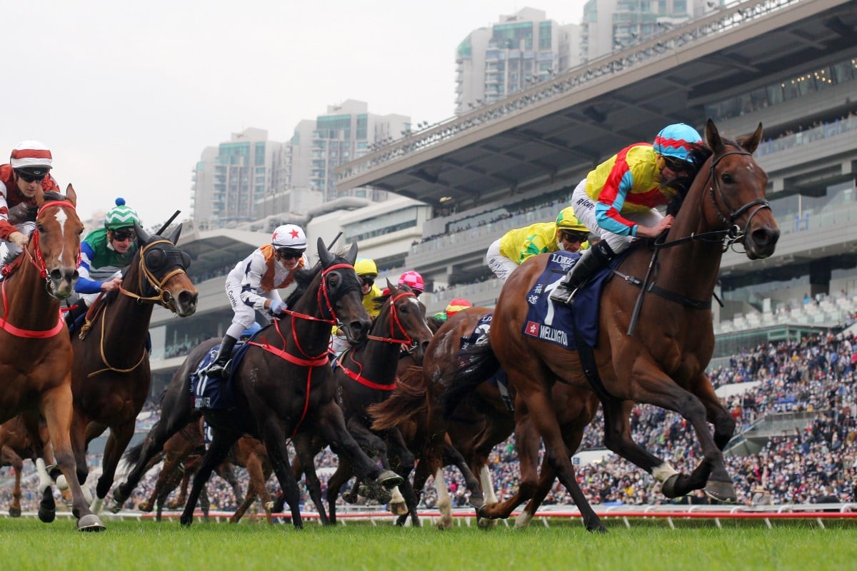 Wellington (yellow colours) wins the Group One Longines Hong Kong Sprint (1,200m) under Ryan Moore at Sha Tin on Sunday. Photos: Kenneth Chan