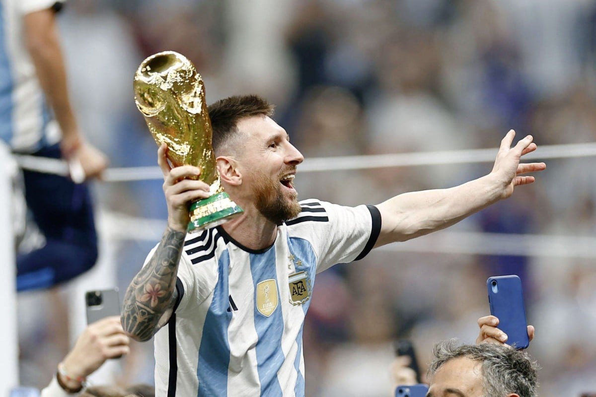 Argentina’s Lionel Messi celebrates with the trophy after the national team beat France in the Fifa World Cup football final at Lusail Stadium in Qatar. Photo: Kyodo