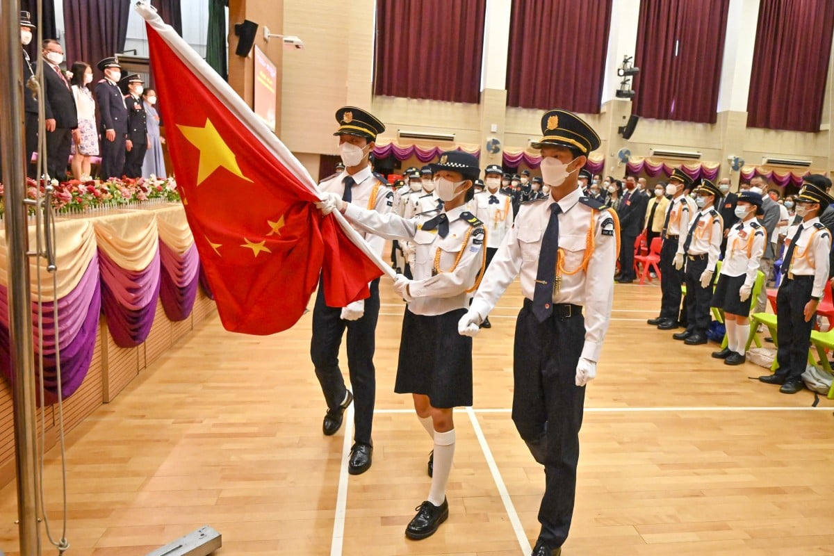 Students take part in a flag-raising ceremony to celebrate the 25th anniversary of Hong Kongs handover from Britain to China at a school in the Tung Chung district of Hong Kong. Photo: AFP