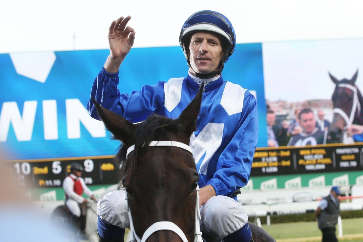 Hugh Bowman celebrates a Group One win aboard Winx in 2018. Photo: Bob Barker/AFP