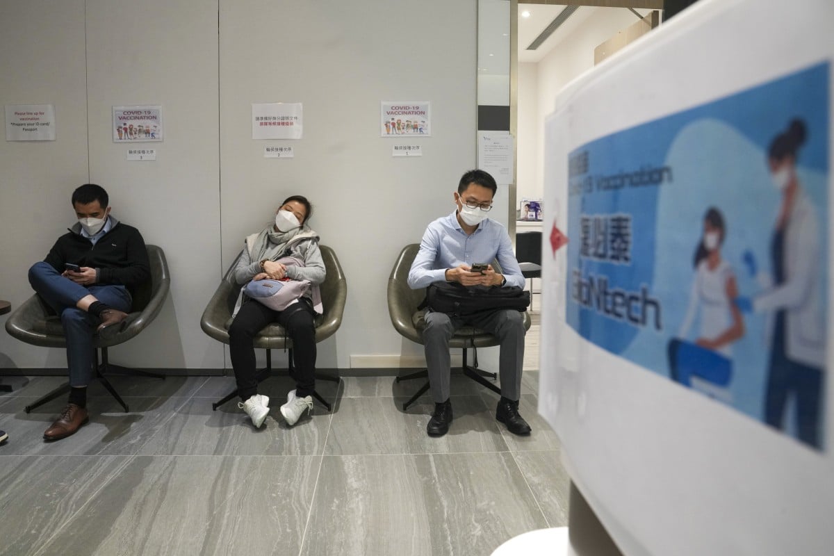 People wait to receive the Covid-19 vaccine at a medical clinic in Tsim Sha Tsui. Photo: Sam Tsang
