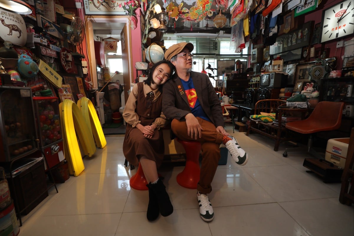 Dick Lam (right) and his 12-year-old daughter Loffy believe teens can better understand history through the memorabilia in his collection. Photo: Xiaomei Chen