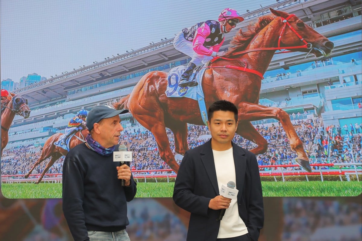Trainer John Size and owner Patrick Kwok discuss Beauty Eternal’s Hong Kong Derby chances at Sha Tin on Thursday. Photo: Kenneth Chan