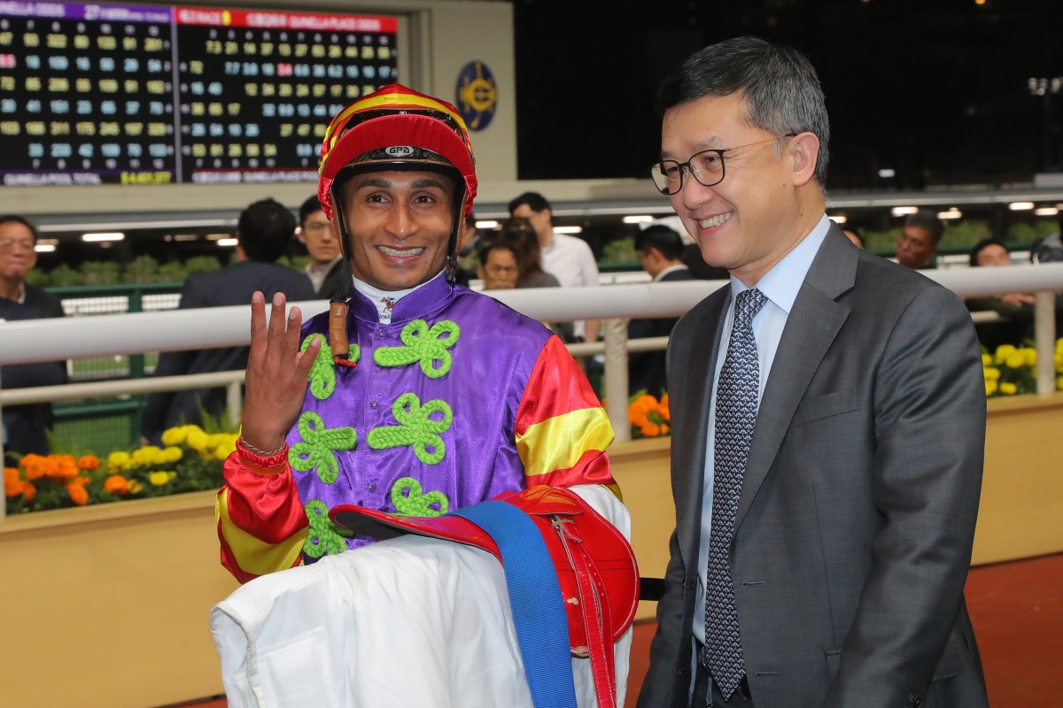 Jockey Karis Teetan celebrates his Happy Valley four-timer with trainer Peter Ho. Photo: Kenneth Chan