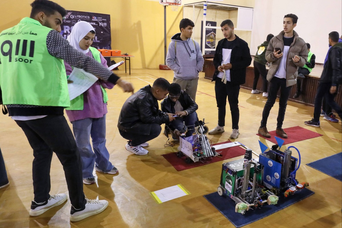 Libyan students worked together at a school gymnasium where the robotics competition took place. Photo: AFP