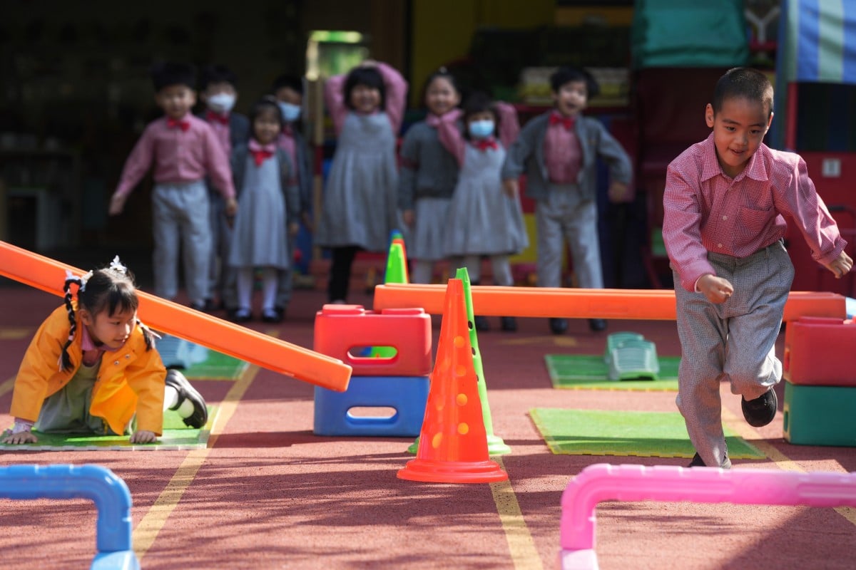 Kids play outside at Creative Kindergarten in Kowloon Tong after the end of the mask mandate. Photo: Elson Li