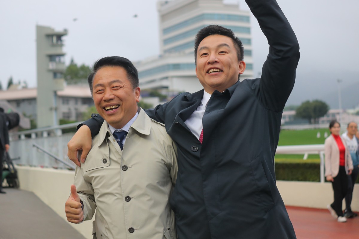 Trainer Ricky Yiu (left) celebrates Voyage Bubble’s BMW Hong Kong Derby win with his son Eric at Sha Tin on Sunday. Photo: Kenneth Chan