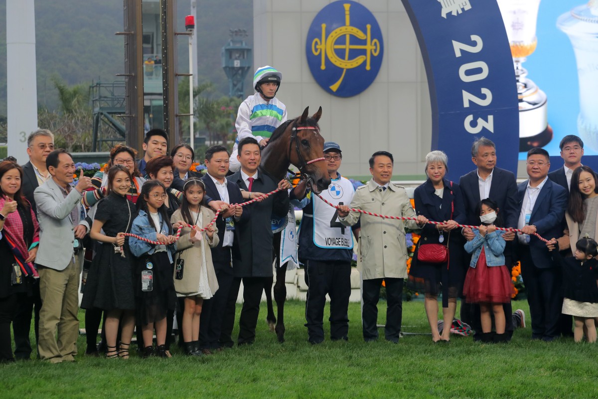 Trainer Ricky Yiu and jockey Alexis Badel celebrate Voyage Bubble’s Hong Kong Derby victory with connections. Photo: Kenneth Chan