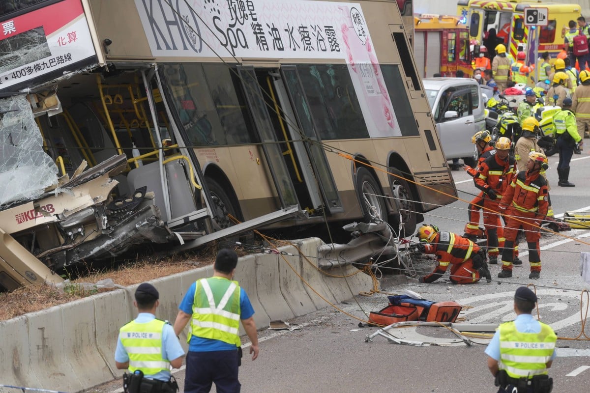 A double decker bus in Hong Kong crashed into a barrier on a busy road on Monday, injuring about 14 people. Rescuers used steel cables to secure the tilted bus and evacuate trapped passengers. Photo: Elson Li