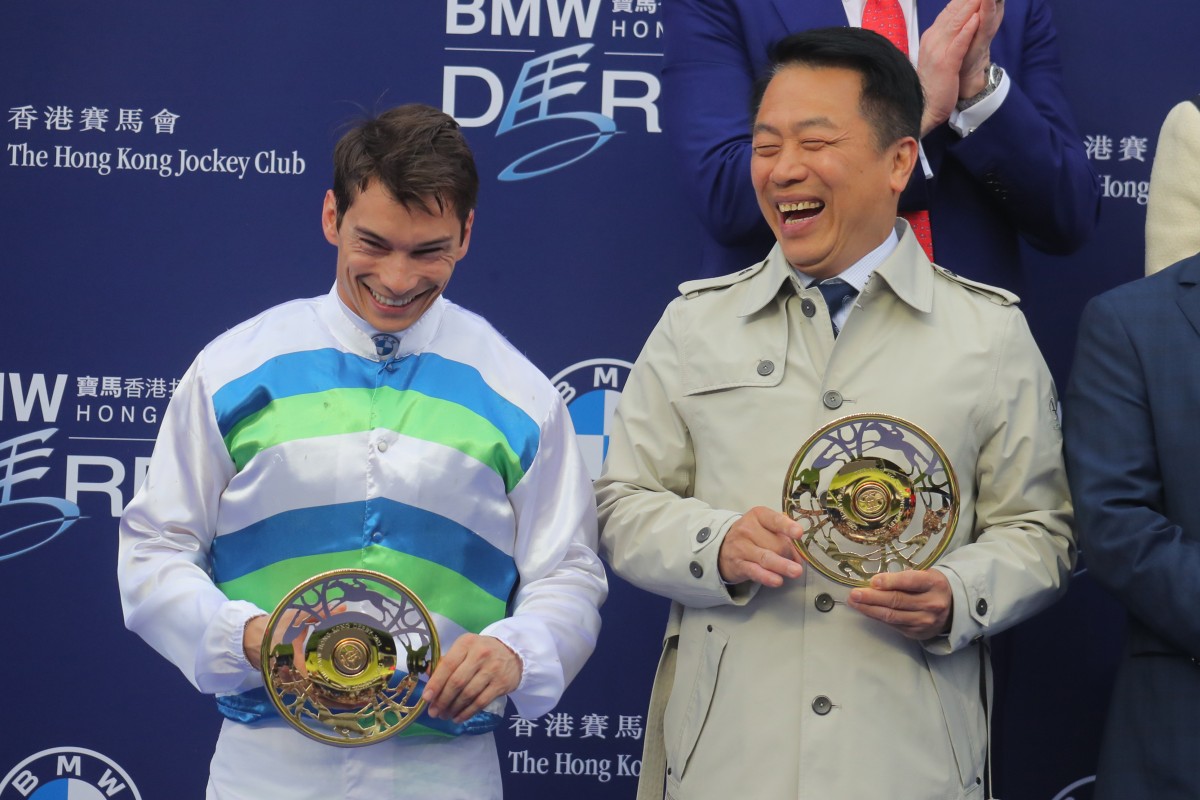 Jockey Alexis Badel and trainer Ricky Yiu receive their Hong Kong Derby trophies following Voyage Bubble’s surprise win in the city’s most prestigious race. Photo: Kenneth Chan
