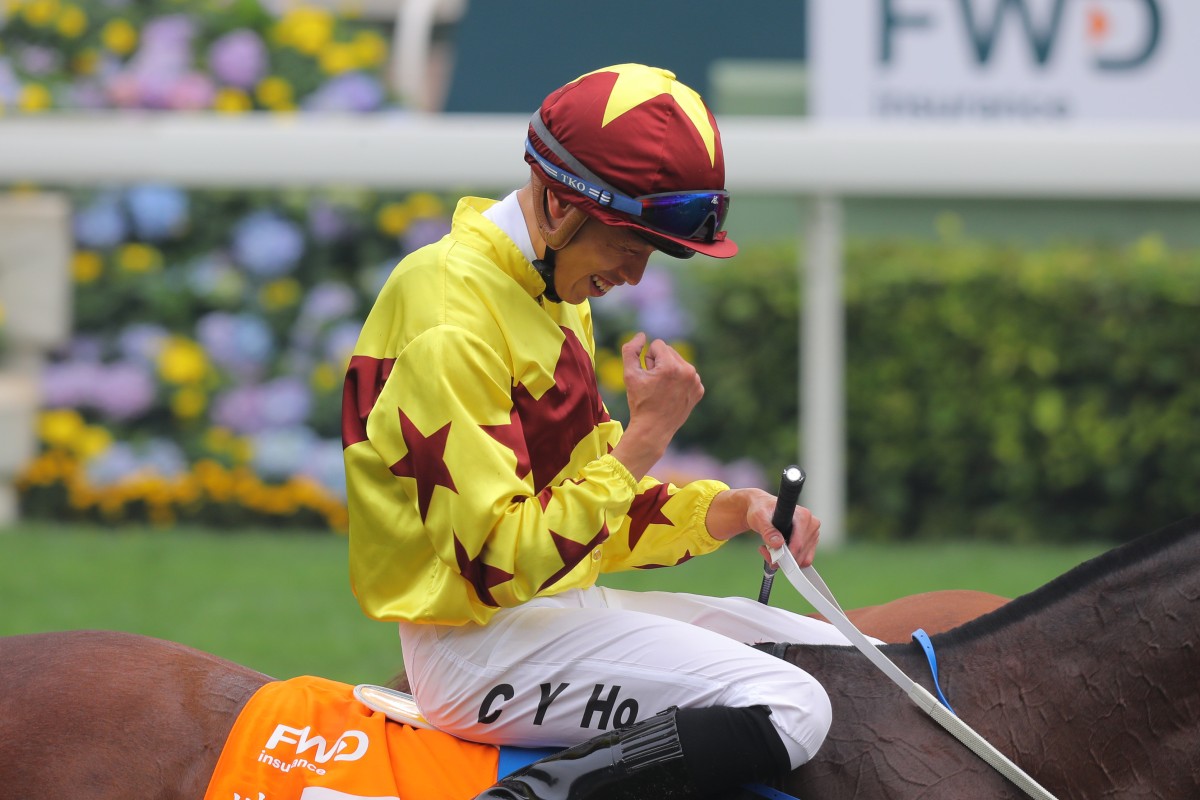 Vincent Ho celebrates after winning the 2020 Champions Mile aboard Southern Legend. Photo: Kenneth Chan