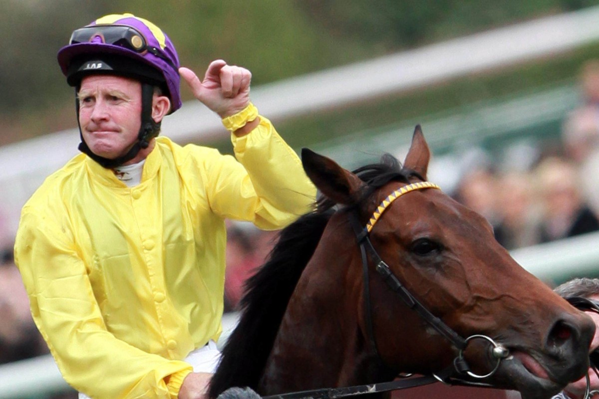 Michael Kinane celebrates winning the 2009 Group One Prix de l’Arc de Triomphe (2,400m) at Longchamp aboard Sea The Stars. Photo: EPA/Ian Langsdon