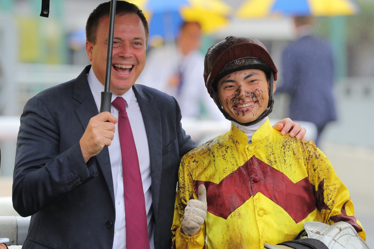 Caspar Fownes and Ellis Wong celebrate the apprentice jockey’s first win, which came aboard Storm Legend at Sha Tin on May 13. Photo: Kenneth Chan