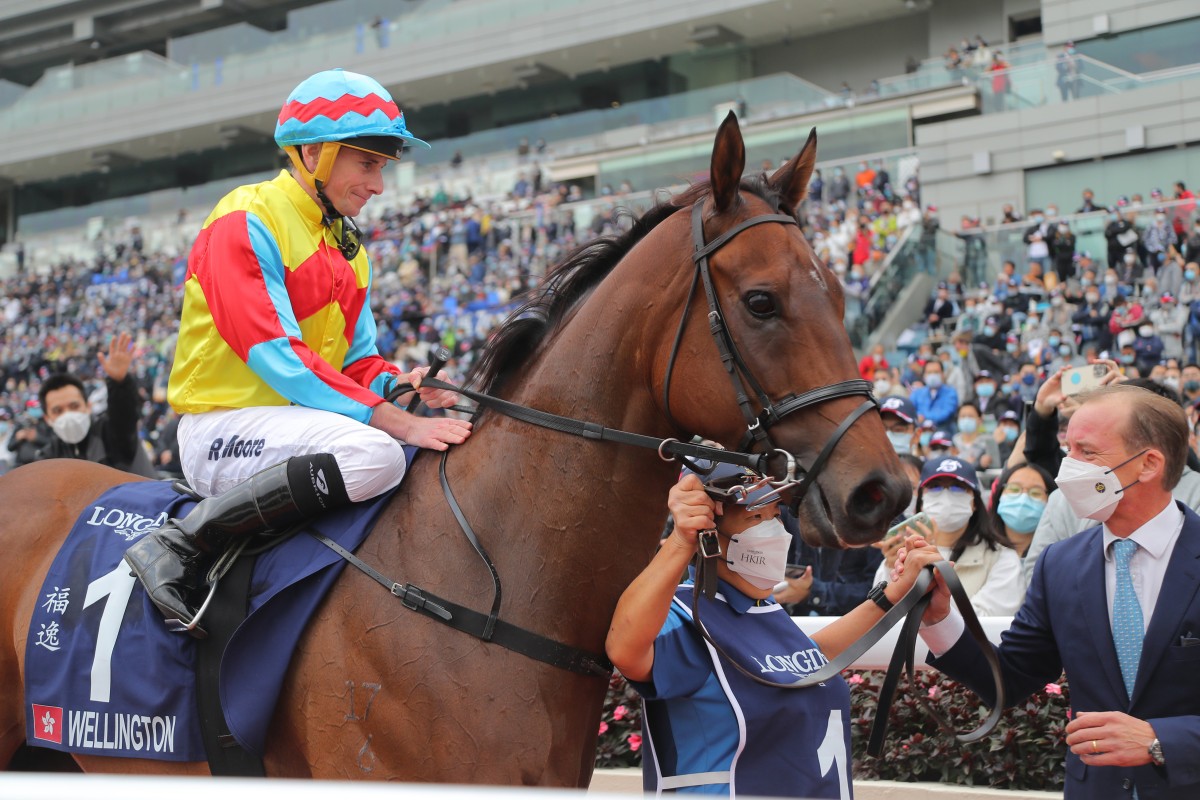 Jockey Ryan Moore and trainer Richard Gibson with Wellington after his Hong Kong Sprint victory. Photos: Kenneth Chan