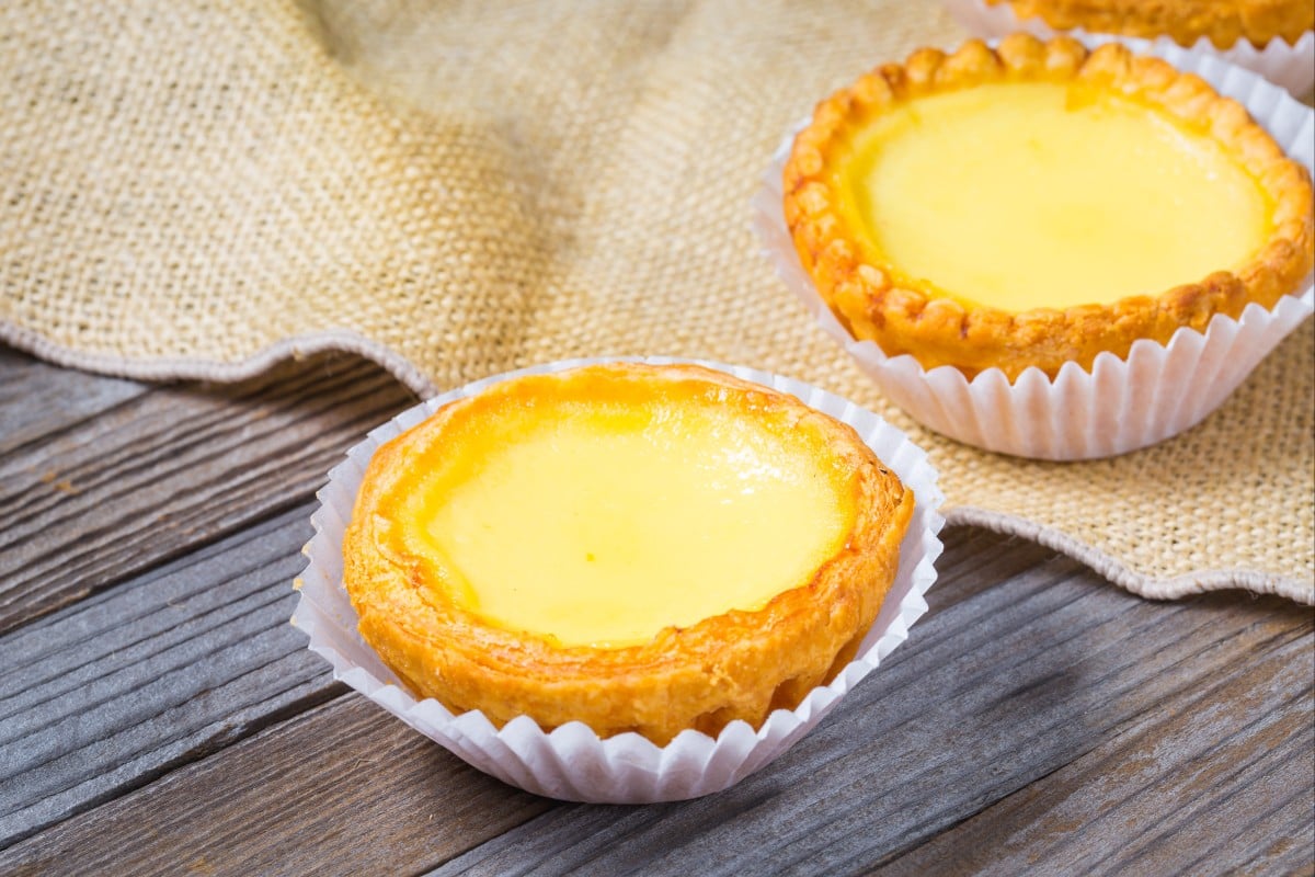 Hong Kong-style egg tarts are known for their silky smooth custard filling. Photo: Shutterstock