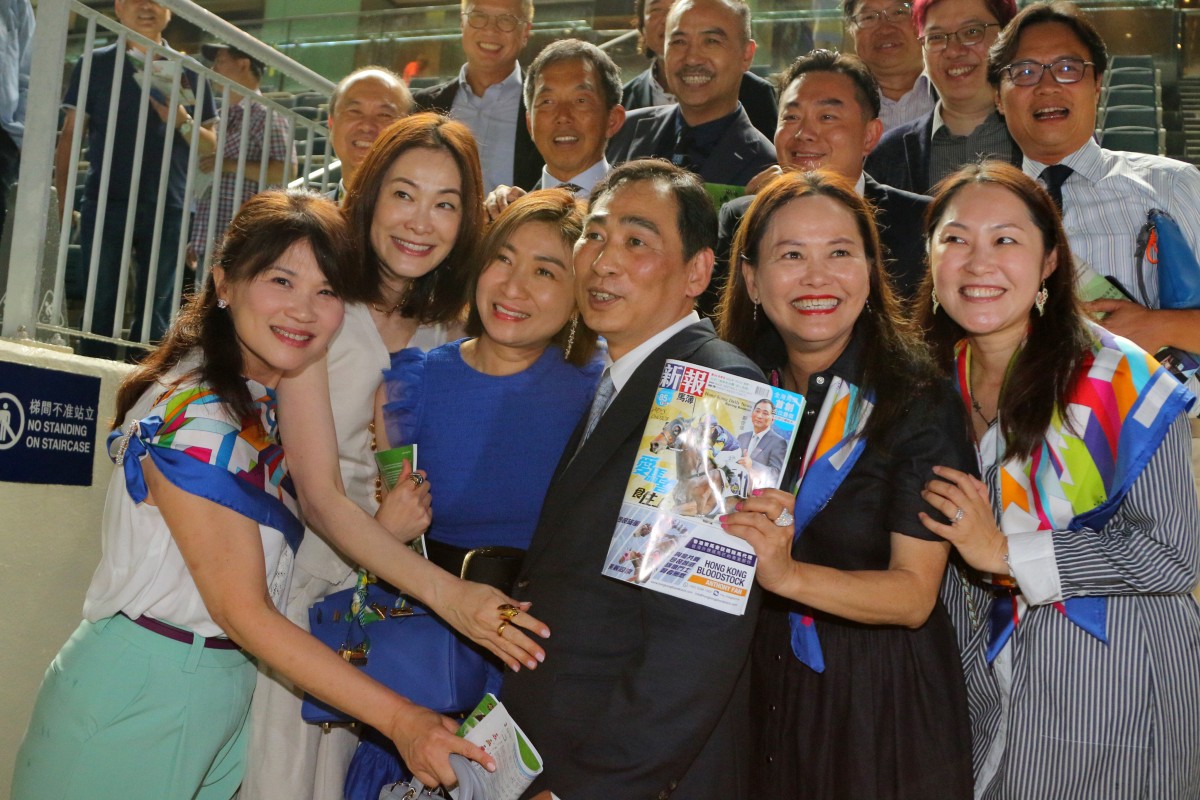 Trainer Michael Chang celebrates his career-saving win with Lady’s Choice’s owners at Sha Tin on Monday night. Photos: Kenneth Chan