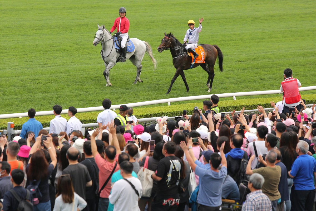 Vincent Ho waves to the crowd after Golden Sixty’s victory in the Champions Mile in April. Photo: Kenneth Chan