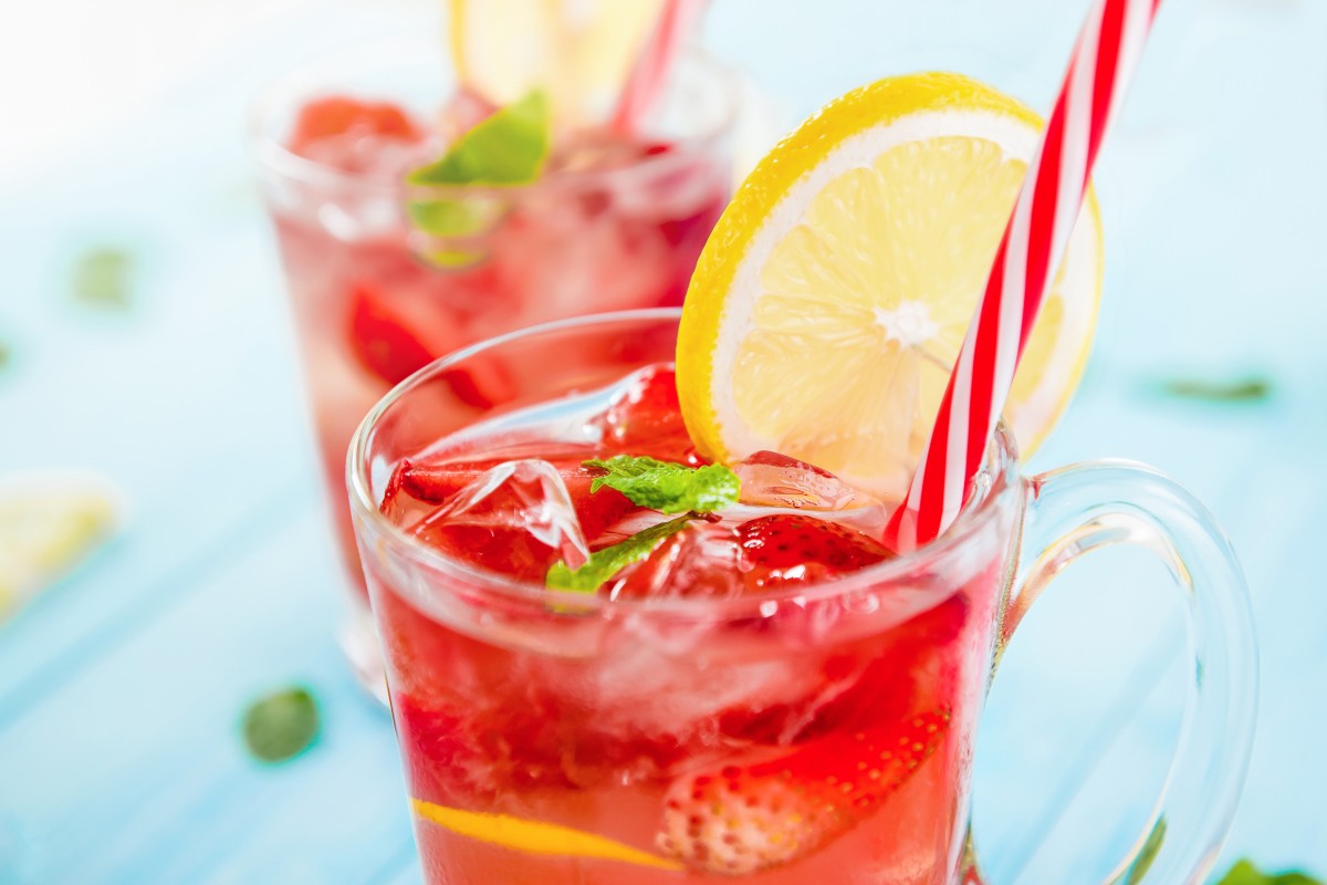 Stay hydrated this summer with a cold glass of strawberry lemonade. Photo: Shutterstock