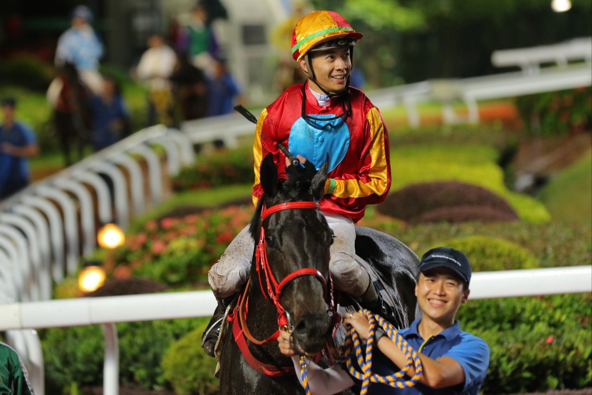 Derek Leung is all smiles after his third straight victory aboard Encountered. Photos: Kenneth Chan