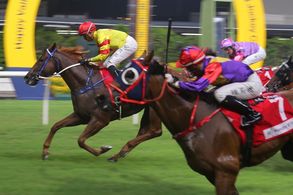 Vincent Ho aboard Capital Delight (yellow and red colours) deat heats with Angus Chung and Lucky Archangel at Happy Valley last night. Photo: Kenneth Chan