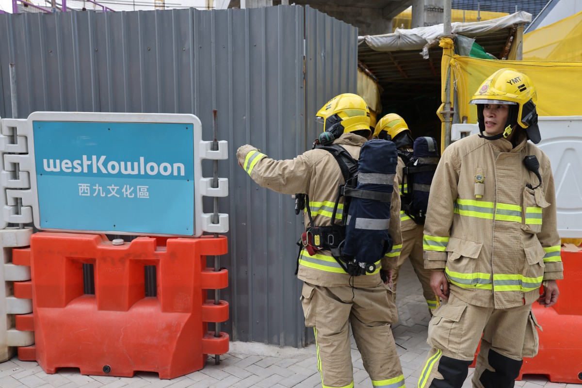 Firemen at the scene of an industrial accident on Austin Road near the West Kowloon Cultural District. Two Hong Kong workers were found dead after a suspected biogas leak at a construction site last month. Photo: Yik Yeung-man
