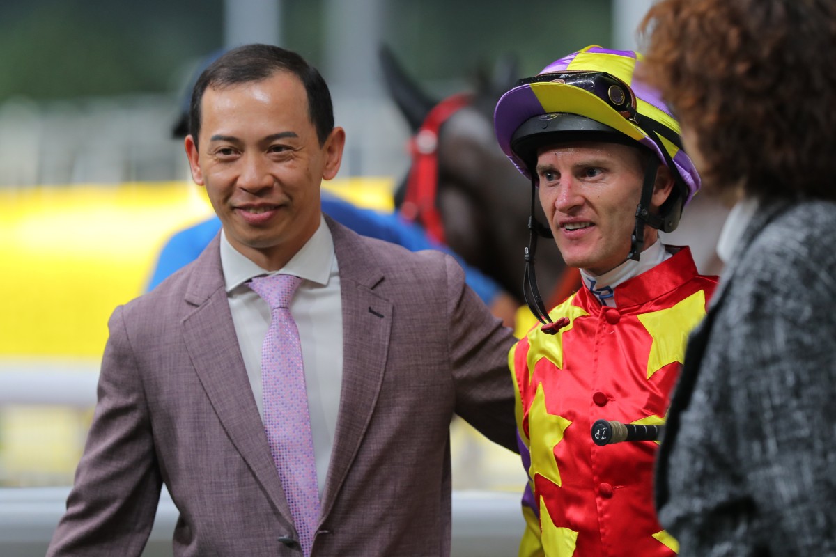 Trainer Cody Mo celebrates his first career victory with jockey Zac Purton on Wednesday night. Photos: Kenneth Chan