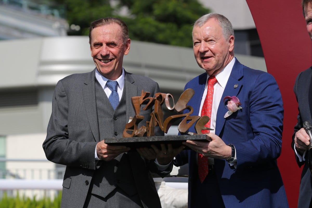 Trainer John Size (left) celebrates his 1,500th Hong Kong win with Jockey Club chief executive Winfried Engelbrecht-Bresges. Photo: Kenneth Chan