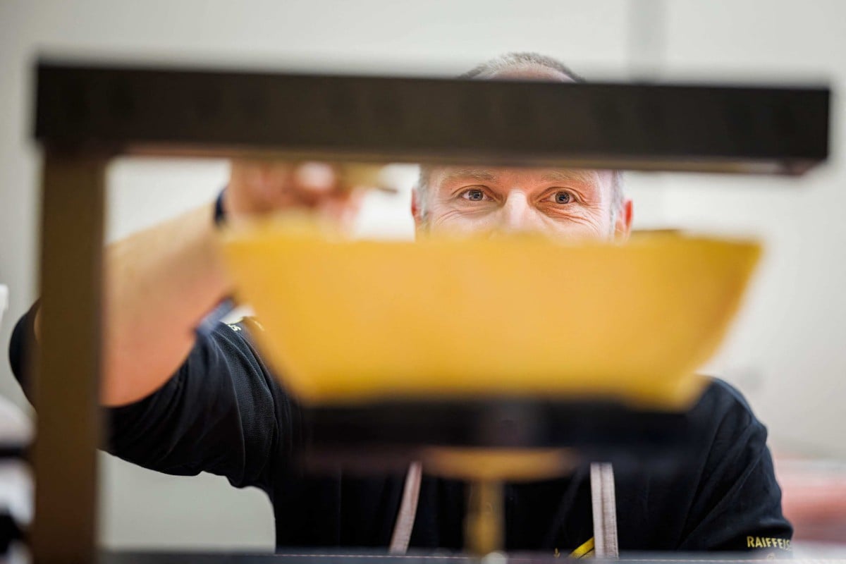 History of Swiss cheese dish raclette comes from mountain herdsmen who would heat their cheese on an open fire and scrape off the melted part. Photo: Reuters