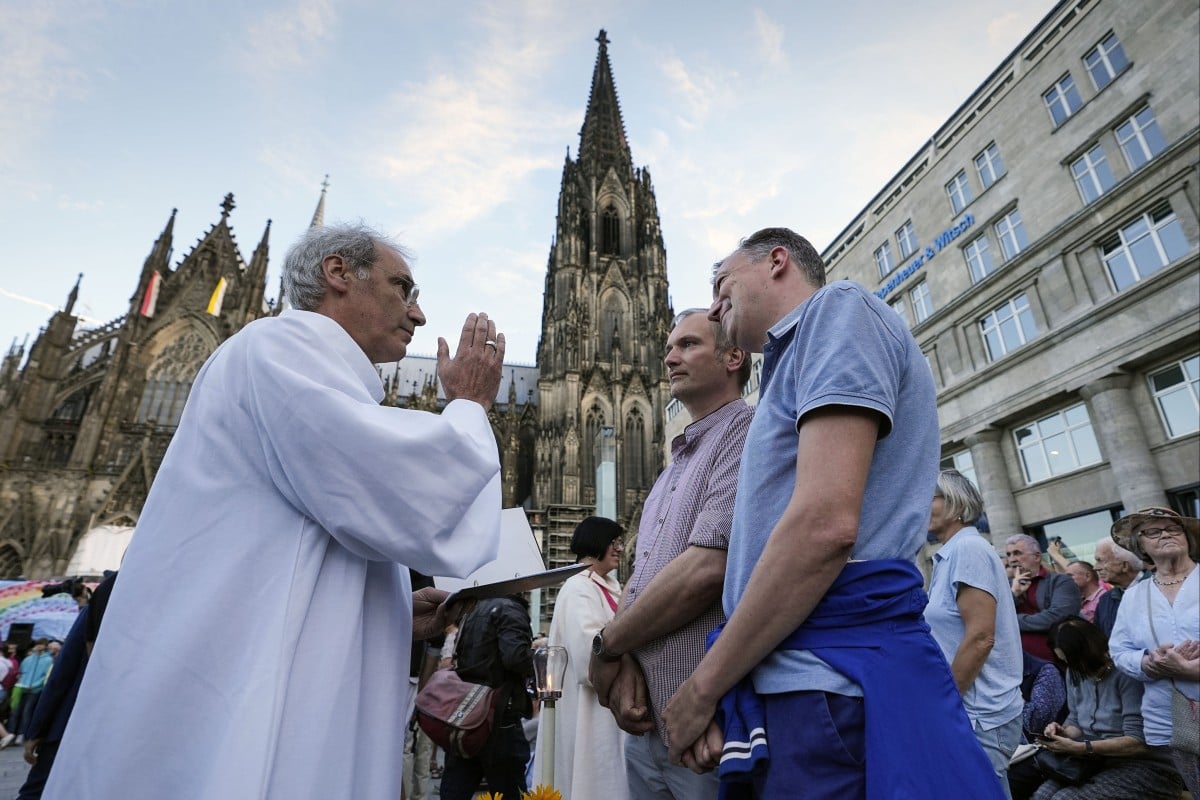 Same-sex couples take part in a public blessing ceremony in front of the Cologne Cathedral in Germany. Photo: AP