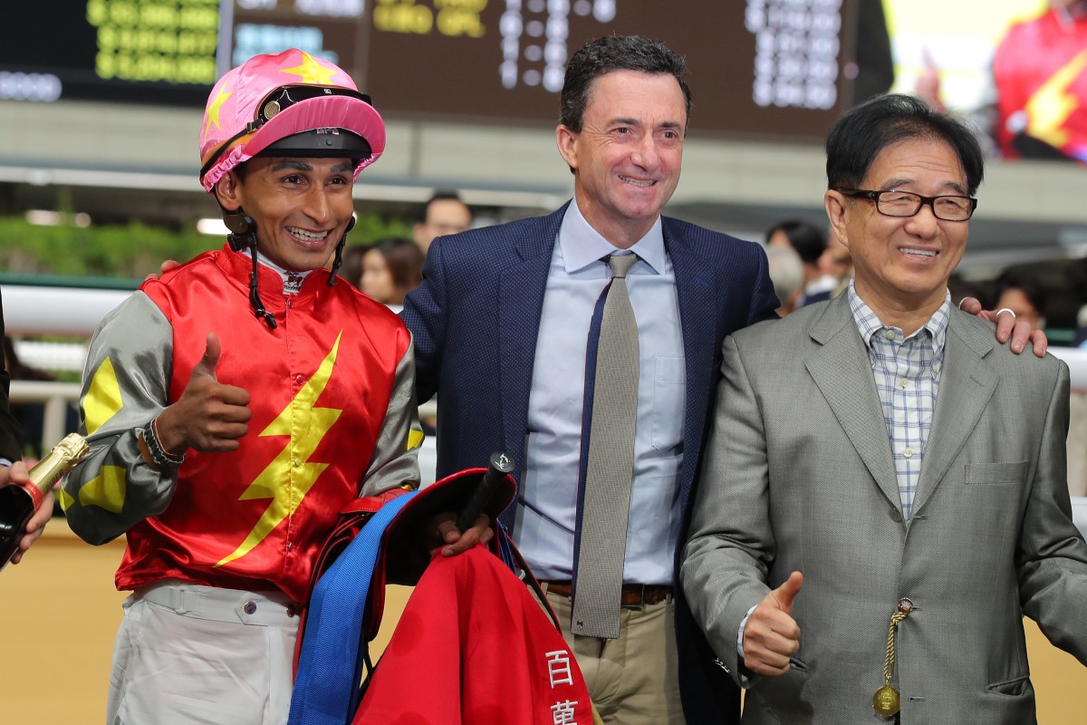 Jockey Karis Teetan and trainer Douglas Whyte celebrate with connections following Majestic Knight’s win at Happy Valley. Photo: Kenneth Chan
