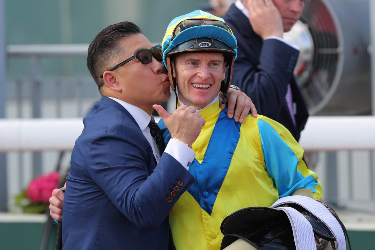 Trainer Dennis Yip kisses jockey Zac Purton after Massive Sovereign’s Hong Kong Derby success. Photos: Kenneth Chan